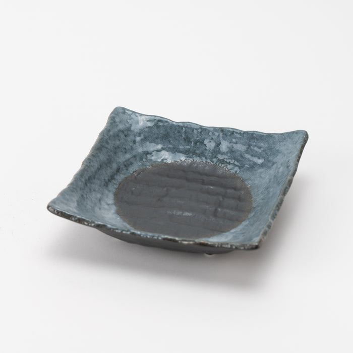 COTOWAKU Black Shino Four-Legged Bowl, a sculptural and functional ceramic piece with a raw, earthy finish.