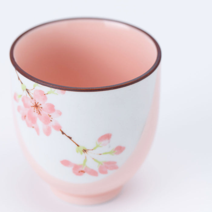 Traditional Japanese Yunomi teacup in a tactile Sakura pink glaze.